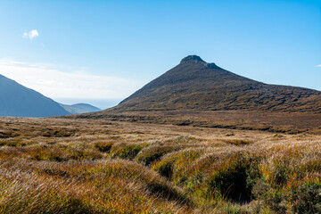 Mourne Mountains Peak With Grass Meadow Landscape. Wilderness Under Clear Sky, Hiking Summer Adventure