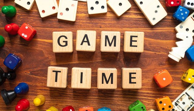 "GAME TIME" Message Spelled with Wooden Cubes Surrounded by Colorful Dice, Dominoes, and Pawns on a Wooden Table