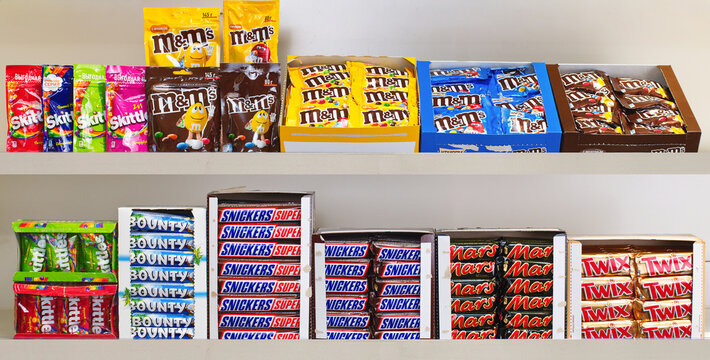Yerevan Armenia 12.5.2025. A shelf full of candy bars including Snickers, Twix, and Milky Way
