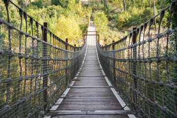Wooden Suspension Bridge over Valley