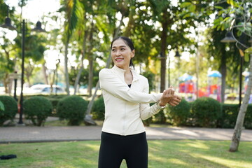 Asian women engage in recreational activities in a park.
