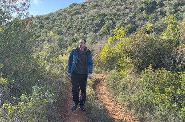 Naklejka premium Rocky Trail in the Forest under the Sky