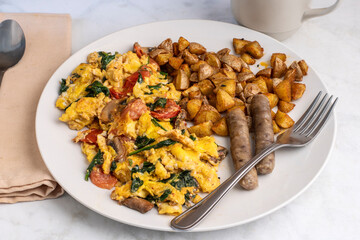 scramble eggs with sausage and home fries,