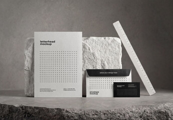 Template Mockup Letterhead Envelope and Business Card Branding Set on Stone Background