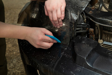 Tinting of the rear headlights of the car.Car design.Detaling center.