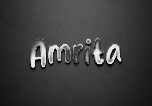 Chrome metal 3D Hindi name design of Amrita on grey background.