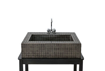 A black sink with a silver faucet sits on a black table