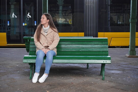 girl on the bench in the railway station