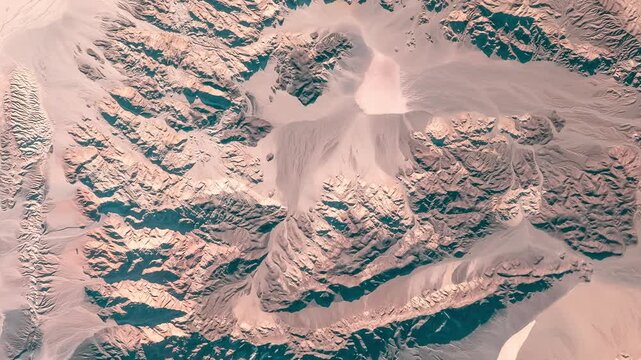 Aerial shot of sandy mountains with prints of erosion in desert. Camera is moving backward and left. Animation based on image by NASA