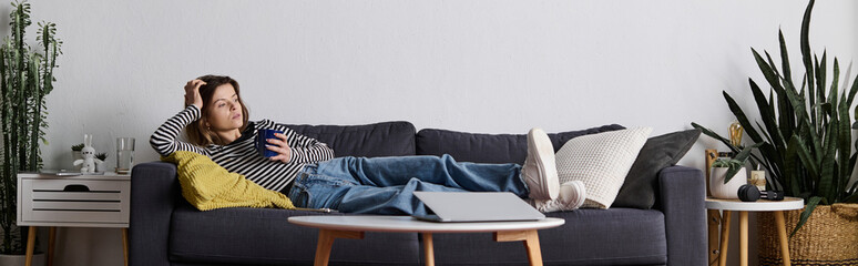 Young woman enjoying a day at home while relaxing on the couch