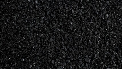 Fototapeta premium Close-up of black textured asphalt surface.