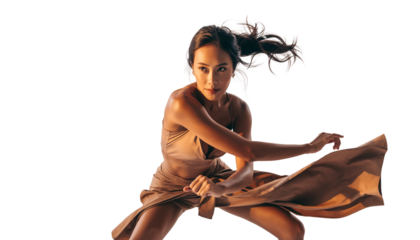 Captivating studio moment: female dancer in elegant, powerful pose
