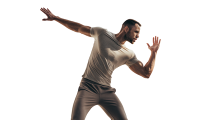 Dynamic man striking a powerful pose, isolated on black background, full-body studio shot