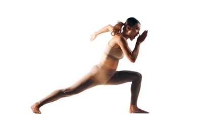 Dynamic shot of an athletic woman in a sprint start position, showing determination and focus.