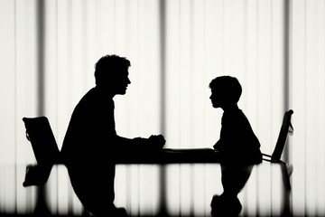 Pair of individuals engaged in learning and teaching in a modern workspace during day time