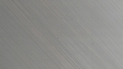 Obraz premium Image of a brushed metal surface with fine linear texture and subtle color variations.