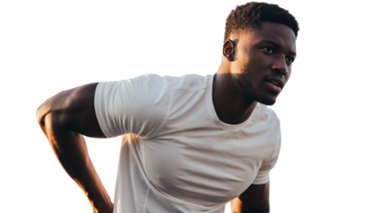 Focused athletic man engaged in intense outdoor fitness training under warm light