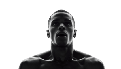 Focused Male Athlete Looking Upwards in Dramatic Black and White Studio Portrait