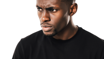 Close-up studio portrait of a young man with a furrowed brow and intense gaze