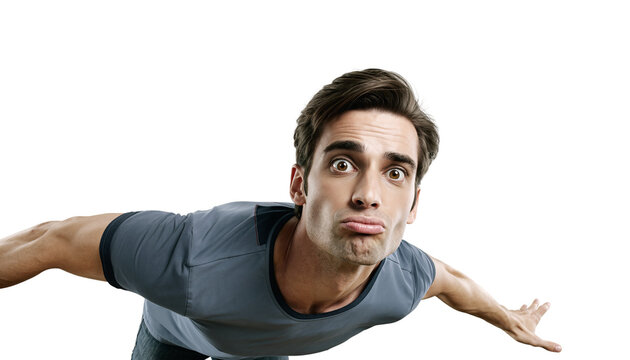 Playful young adult man with a funny pouting face making a surprised expression against a black background