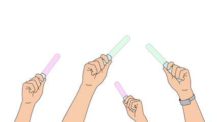 Multiple hands joyfully brandish glowing light sticks, creating a captivating visual of excitement and shared experience at a vibrant social event