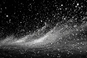 Obraz premium Snow falling gently on dark clouds during winter night creating a snowy scene above the landscape