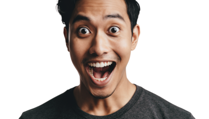 Close-up portrait of an excited young man with wide eyes and open mouth expressing surprise