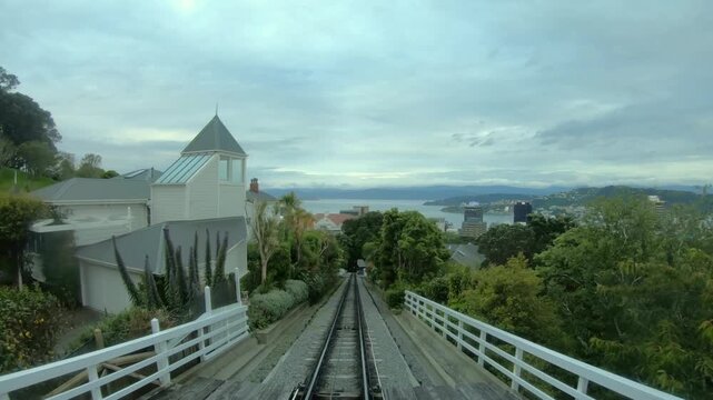 Cable car traveling downhill through the suburb of Kelburn to the city of Wellington, New Zealand