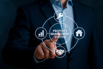 Businessperson pointing at property management system for the concept of Real estate and technology.