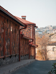 A row of houses with red roofs and stone walls