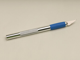 Pen cutter on white background