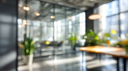 Fototapeta premium Blurred modern office interior with glass partitions and plants