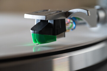 Vinyl record player stylus vintage turntable. Analog audio retro music. Sound nostalgic equipment.