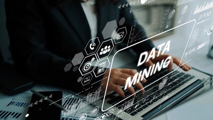 Business professional working on laptop with digital data mining graphics overlay. Asymptotic smart data analytic.