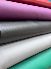 Thick fabric for furniture upholstery, sewing, and crafts. Faux leather in rolls.