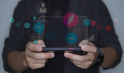 Businessman using a smartphone with social network icons and digital communication concept