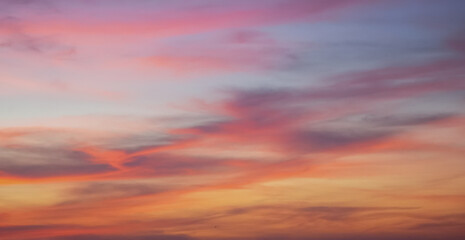 Beautiful sunset sky with colorful clouds glowing in the evening light
