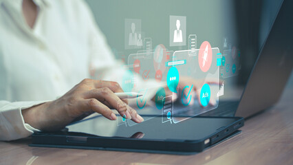 Business professionals working on laptops in a modern office setting