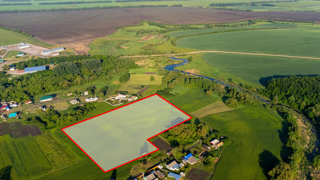 A piece of land, encompassing a view from above, a specific point on the ground, and a line that marks its boundaries. This land can be purchased, sold, developed, rented, or invested in. High quality