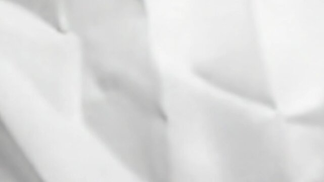 Video A close-up shot of a plain white sheet of paper, suitable for use in presentations, reports or educational settings