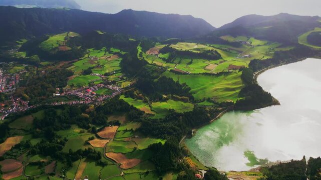 Panoramic view of Lagoa das Furnas volcanic crater lake seen from Pico do Ferro viewpoint in Sao Miguel, Azores.