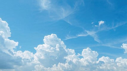 Vast blue sky with fluffy white clouds and wispy cirrus clouds. Clear weather and peaceful atmosphere.