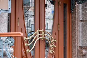 Elegant bronze doors invite visitors to a grand entrance