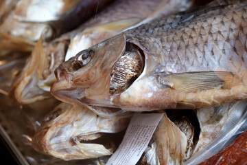 Freshly dried fish on display at a local market stall