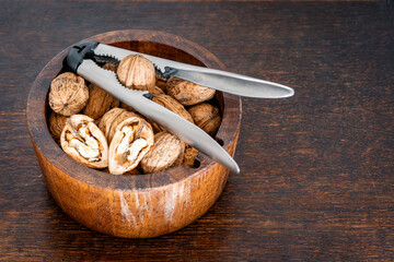 Walnuts and Nutcracker in Wooden Bowl, Healthy Snack, Autumn Harvest, and Rustic Still Life