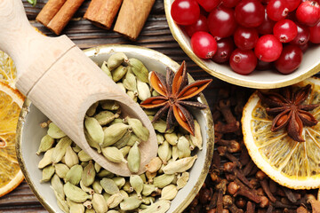 Different spices and cranberries for mulled wine on table, flat lay