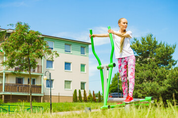Girl exercise at outdoor gym area