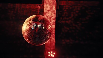 Disco ball glowing under warm club lights - Powered by Adobe