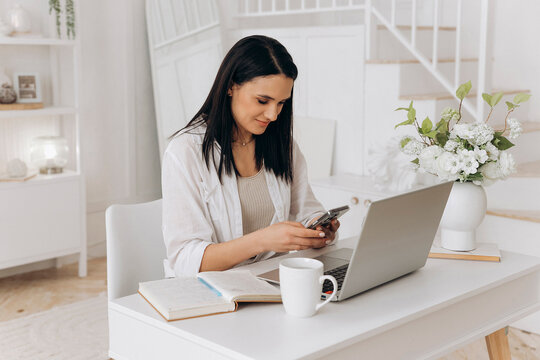 Female entrepreneur reviews sales and inventory, Caucasian woman updates product details on digital devices, Independent woman skillfully handles order processing and inventory management digitally