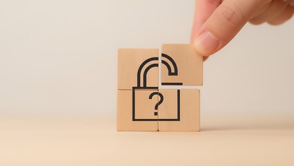 Hand assembling wooden blocks to form an unlocked padlock icon